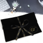 Custom black velvet Envelope bag for wig hair with gold logo and ribbon tie 